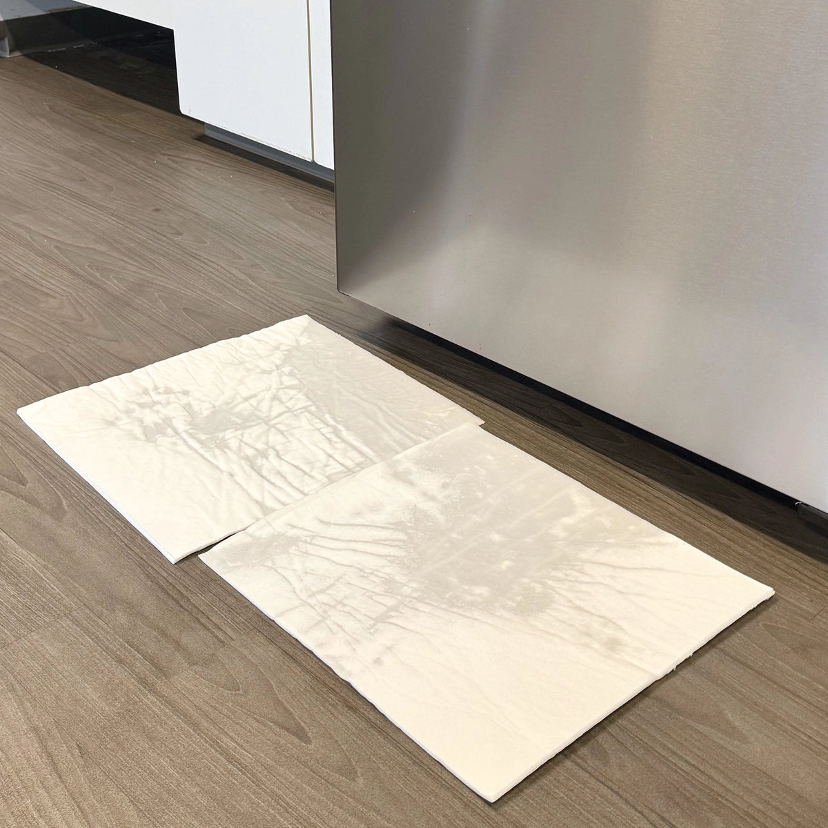 White pads on a wooden floor